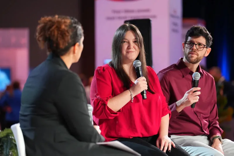 Lorena Lovric answering a question on a conference panel